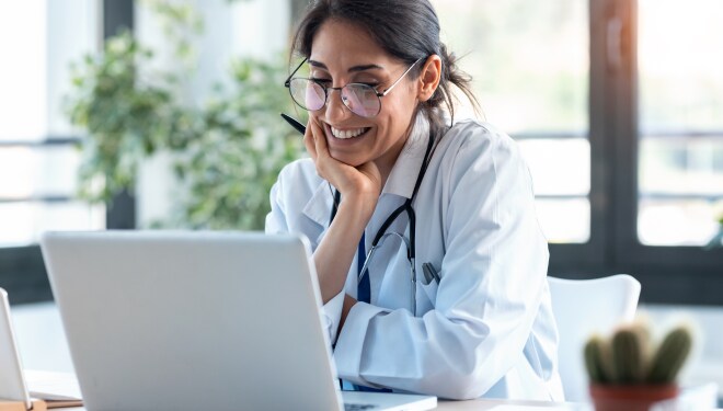 Vet looking at the laptop