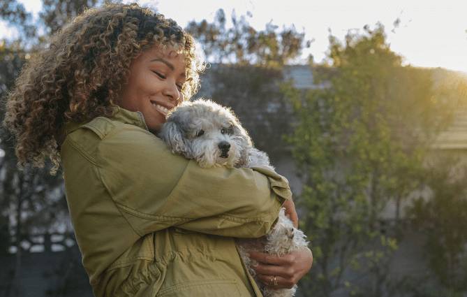 Dog with her pet parent